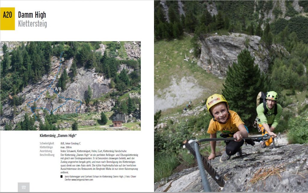 Das Bild zeigt die Startseite der Kletterarena Damm High im Maltatal Guidebook. Ein Junge schaut fröhlich am Klettersteig in die Camera, dahinter der Vater. Im Hintergrund eine alpine Wiese und ein Felsblock.